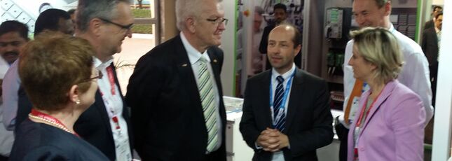 Minister President Kretschmann visits the stand of the Andreas Maier GmbH & Co. KG.
